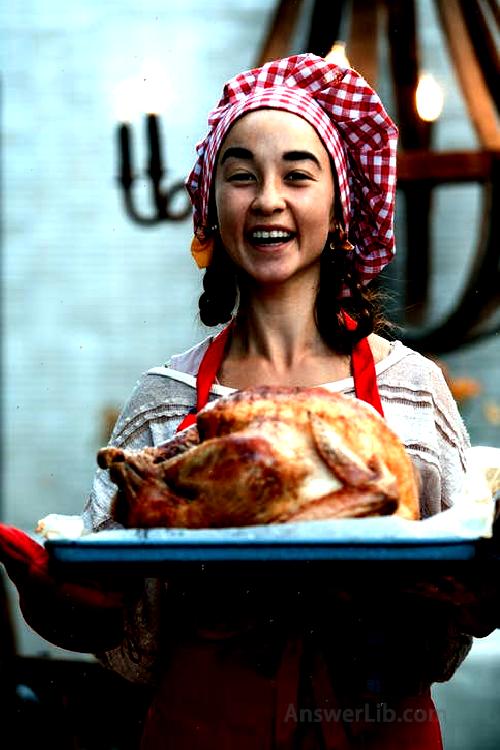 A woman with black bread and white headscarf