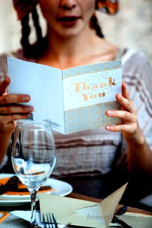 Women holding a white birthday happy card