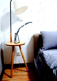 White shade lamp on the bed